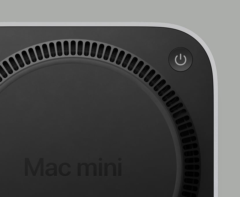 Apple Mac Mini desktop computer on a workspace for professional hardware repair at iAssist Repair.